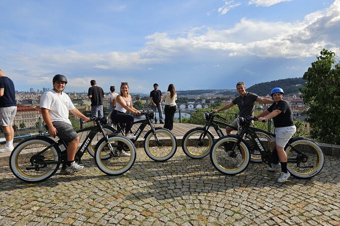 Ebike tour in Prague - Express Tour - Charles Bridge from the bike lane: views along the river, with quick bridge context