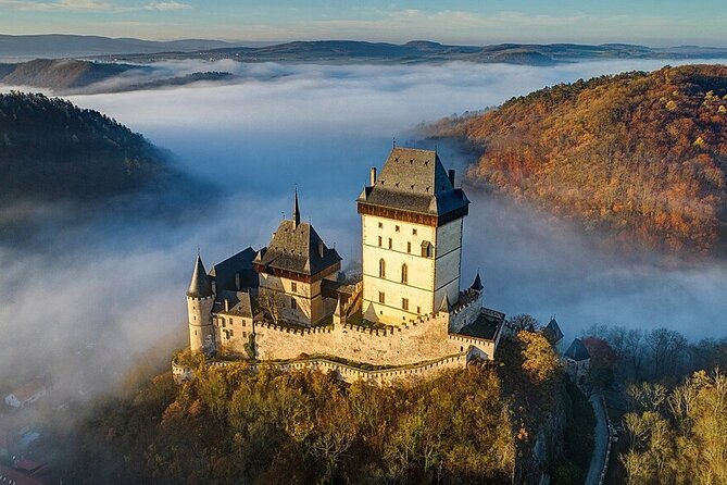 From Prague: Small-Group Karlstejn Castle & Koneprusy Caves Trip - Karlštejn Castle: Charles IV, crown-jewel protection, and what you get in the guided tour