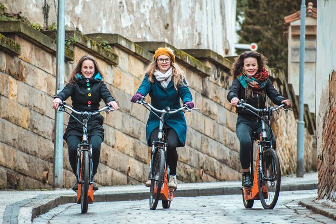 Prague Bike Tour - Halfway break by the Vltava: grab a drink on your own tab