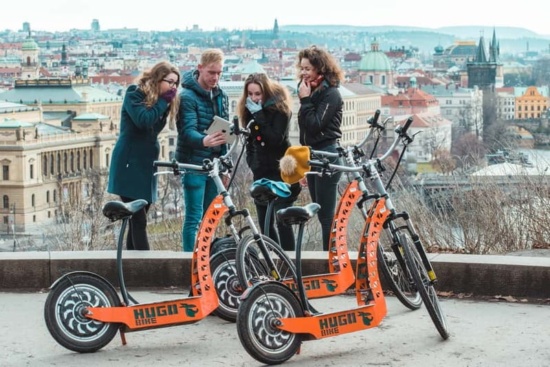 Prague: Fat Tire or Regular Scooter Tour with A Local Guide - Picking the right ride: Hugo Bike or SCROOSER Fat Tire