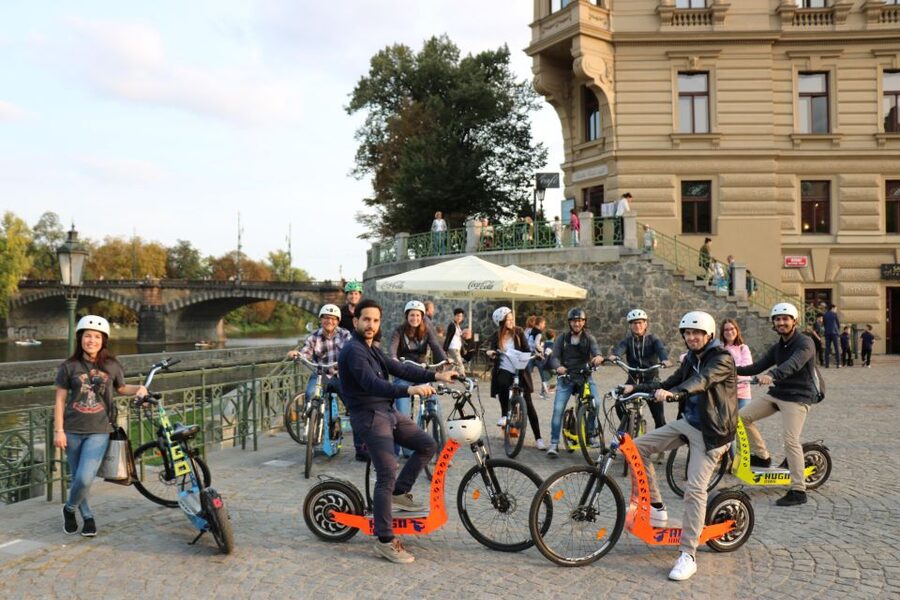 Prague: Grand Segway and eScooter Live Guided City Tour - Old Town snapshots: Lennon Wall, Kampa, Charles Bridge, and river energy