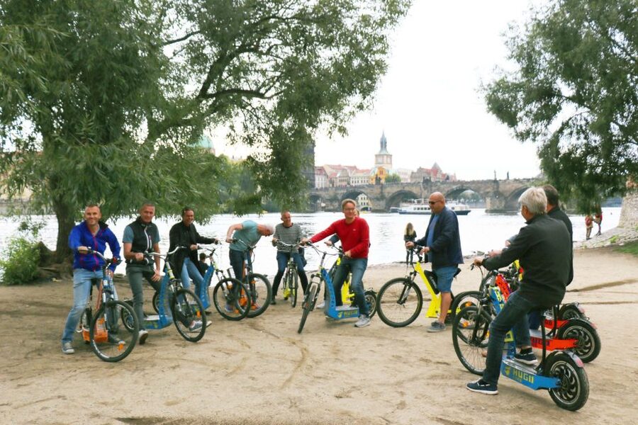 Prague: Grand Segway and eScooter Live Guided City Tour - Swapping gear near the Castle area for the best ride flow