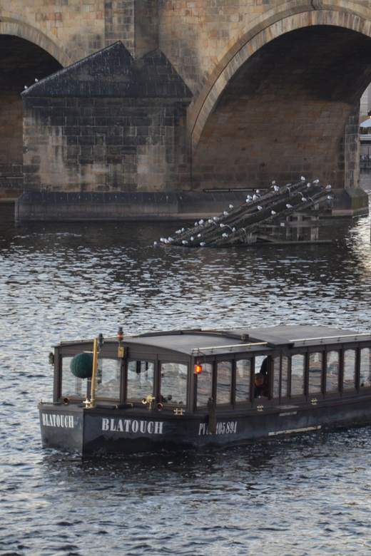 Prague: Old Town Guided Walking Tour and City Boat Ride - The Vltava boat ride: headset stories, Prague Castle photos, and a calmer pace
