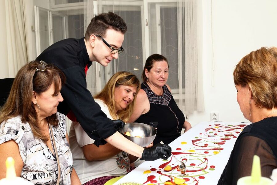 Prague: Savor 10 Course Dinner in Chef’s Kitchen - Entering Chef Ladislav’s chef’s-kitchen world (red jacket, candles, and calm)