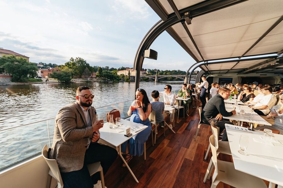 Prague: Sightseeing Dinner Cruise on Open-Top Glass Boat - Live music on the water: romantic, but also fun